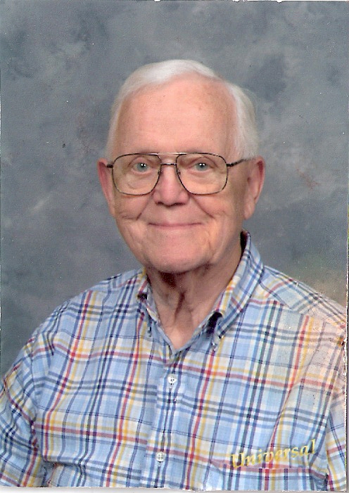 Portrait of William F. Hartnett, smiling.