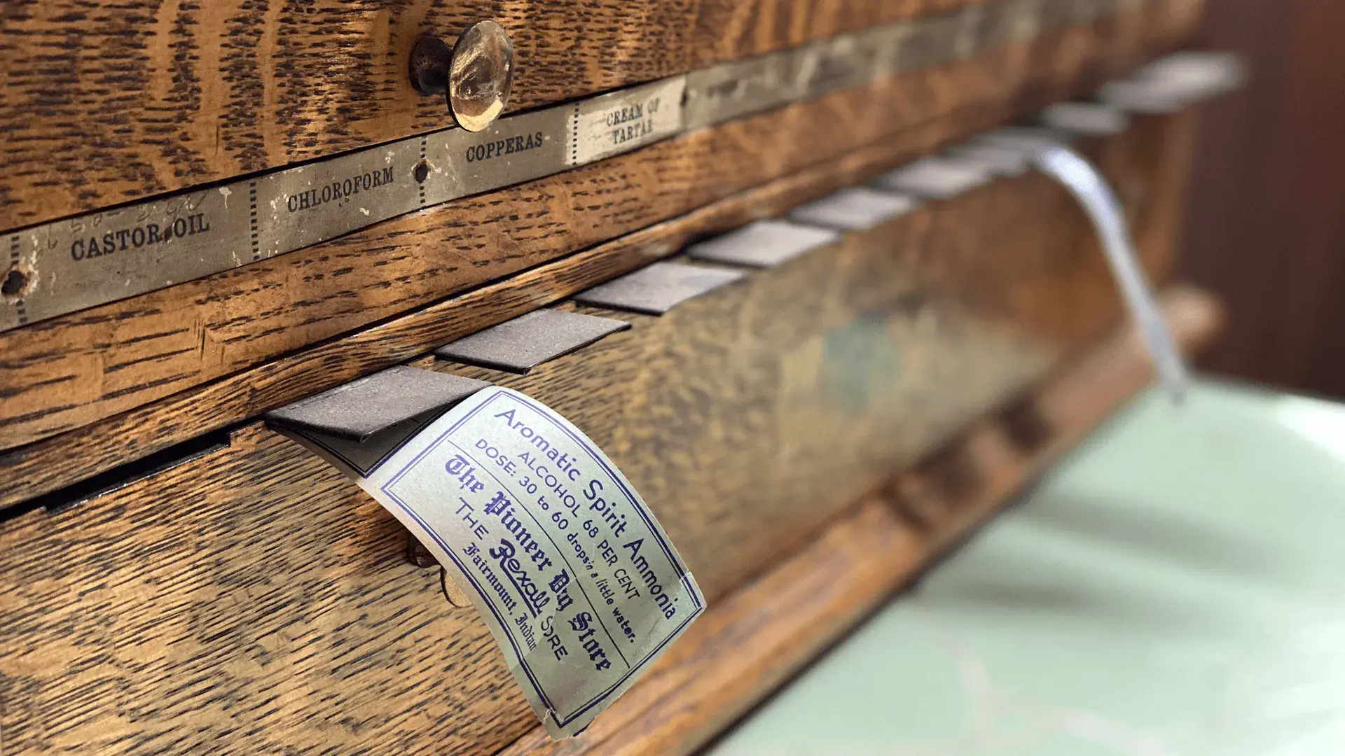 Side view of old wooden box with vintage labels.