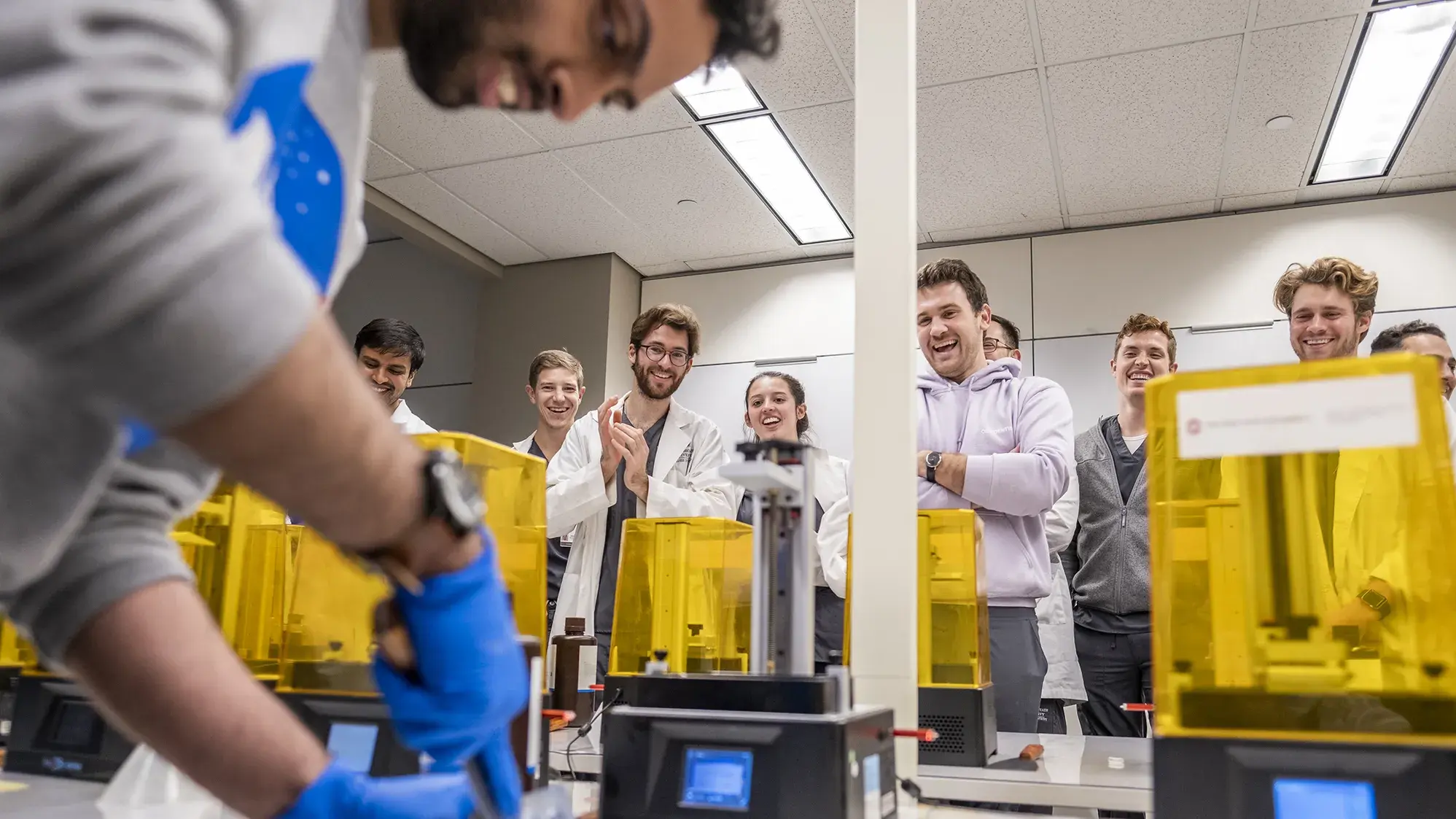 dentistry facluty teaching students how to use the 3D printing lab in Prior Hall