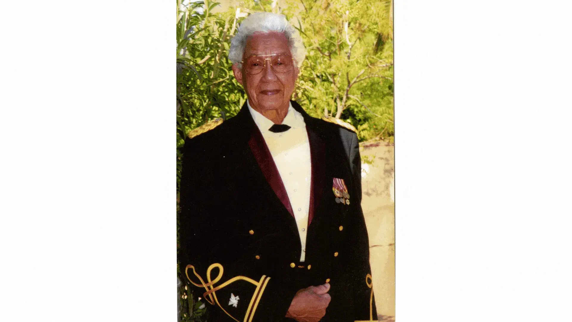 Clotilde Bowen posing in her formal military attire, smiling.