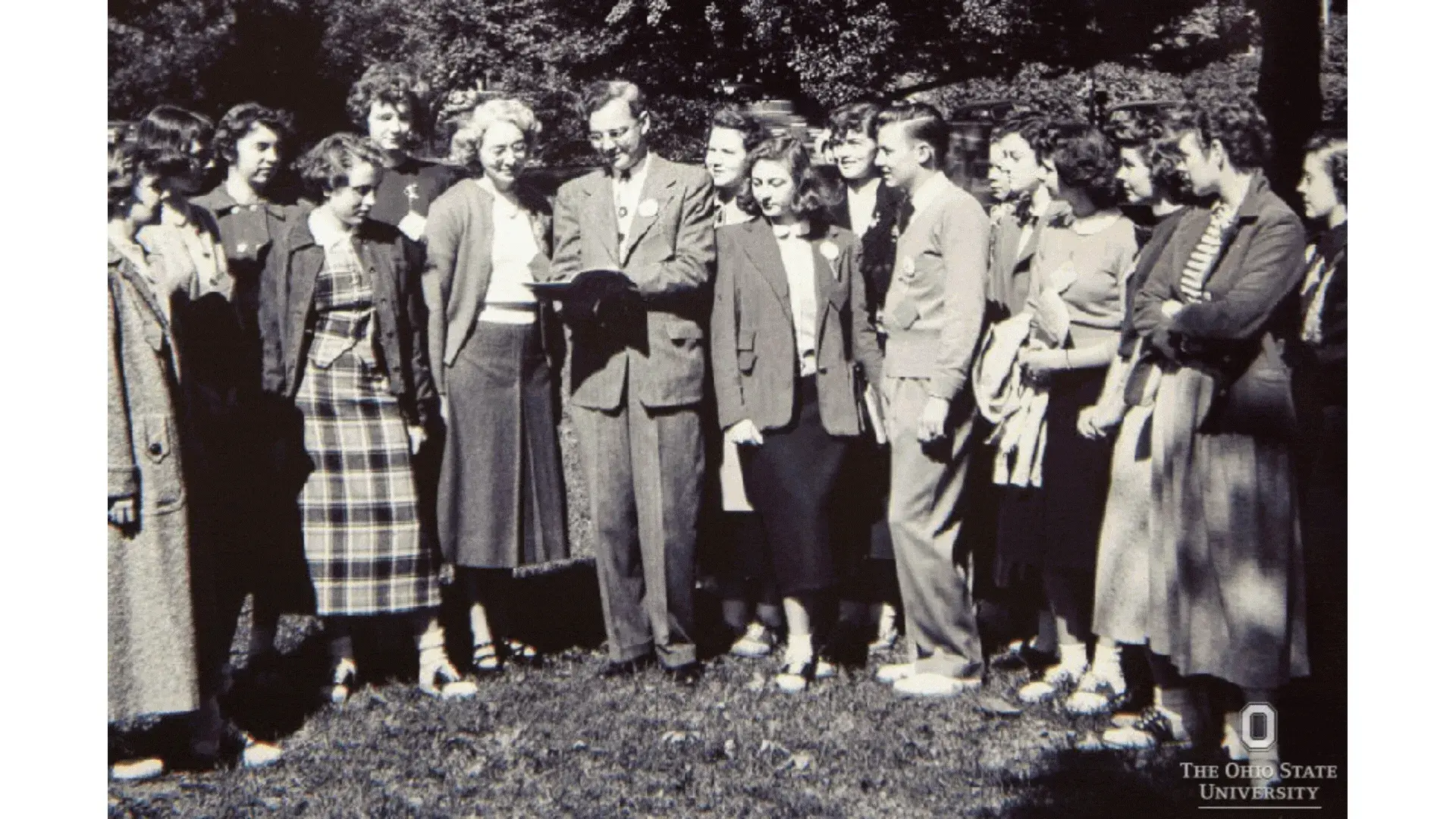 Manuel Tzagournis standing with a group of Ohio State students outside.