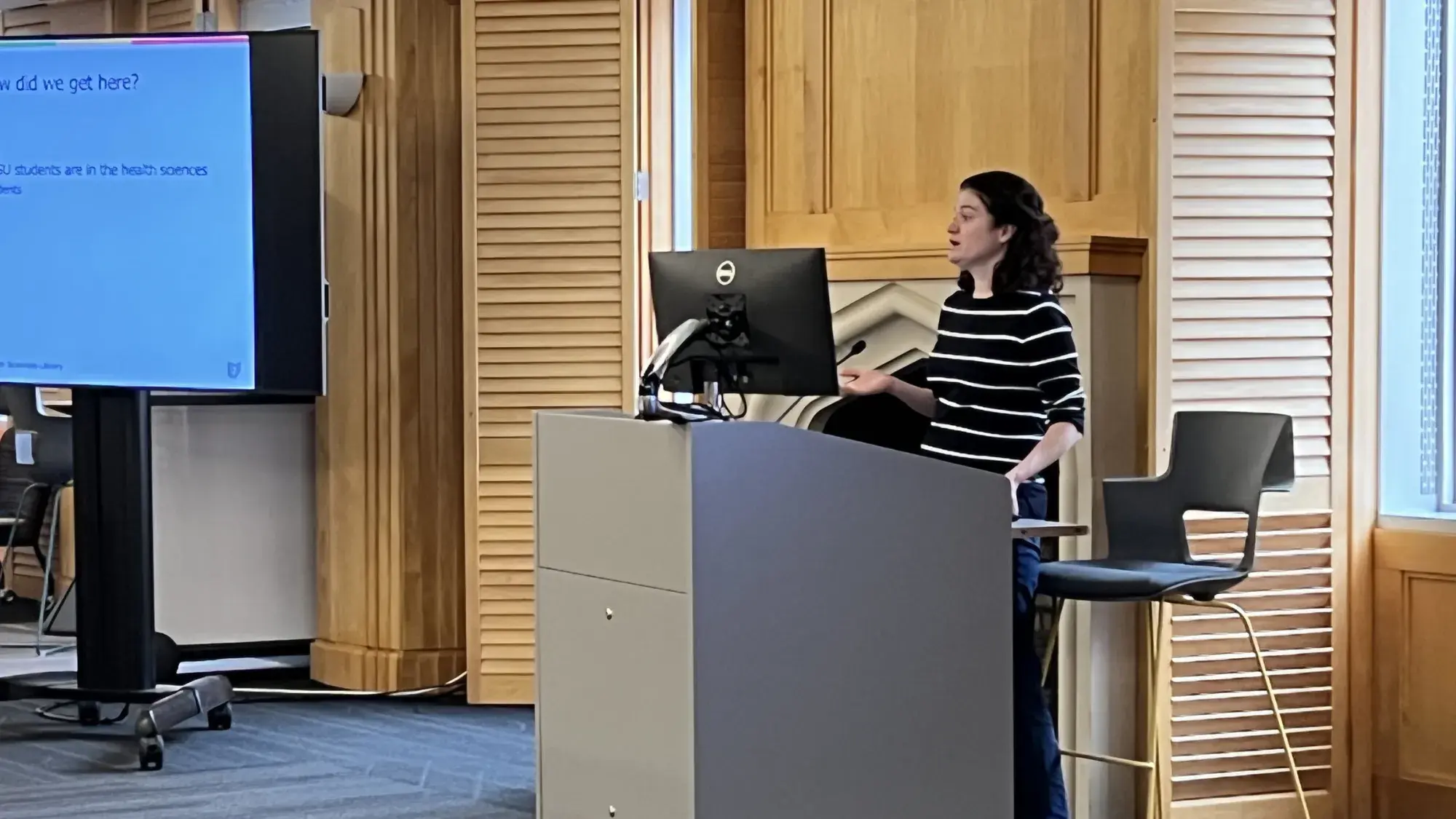 Staff member presenting slides.