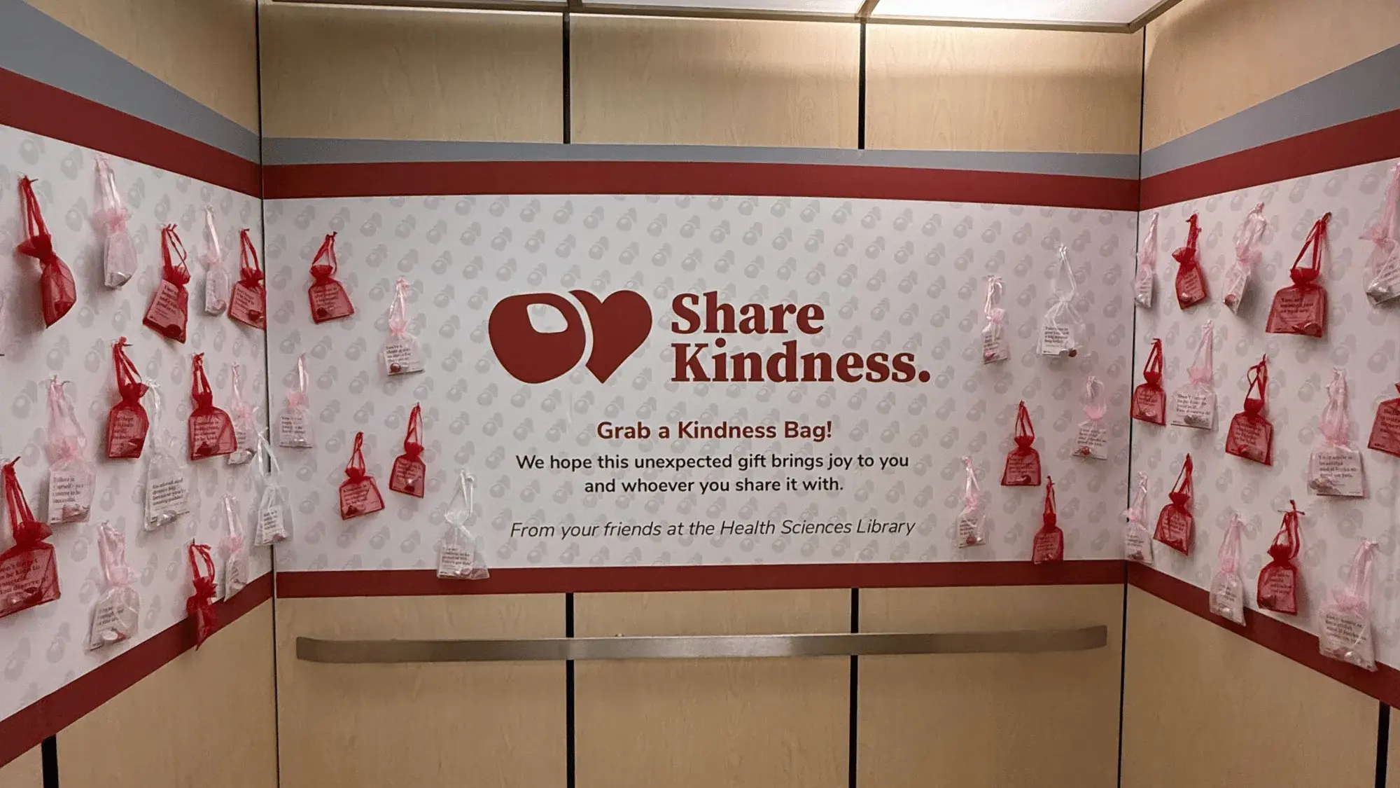 Interior of elevator decorated with Share Kindness theme