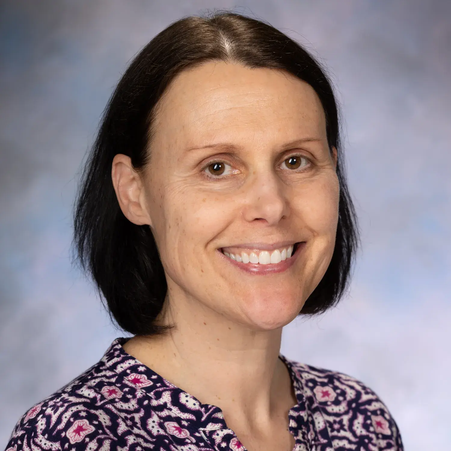 Susi Miller, smiling.